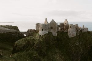 Ireland old medieval ruins of Dunluce Castle on ocean coast in northern Ireland famous place in uk